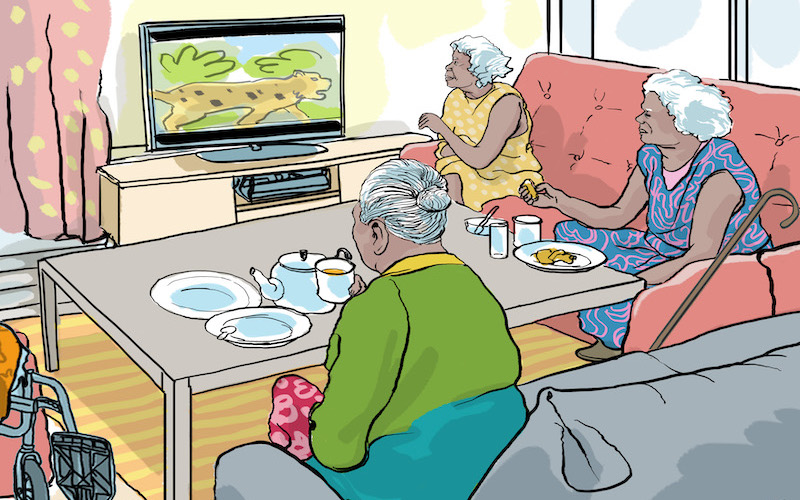 Elderly indigenous women watching television while having morning tea